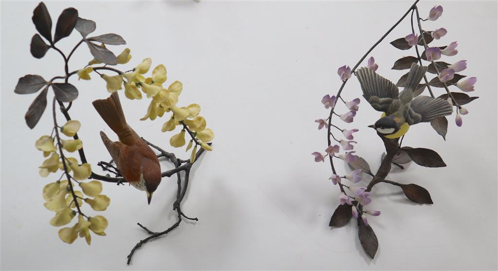 A Boehm model Thrush on a branch with yellow wisteria, and a Coal Tit Thrush on a branch surrounded by lilac wisteria, tallest 29cm
